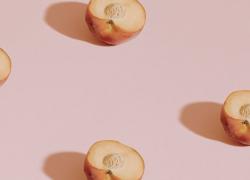 peaches on pink background