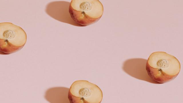 peaches on pink background