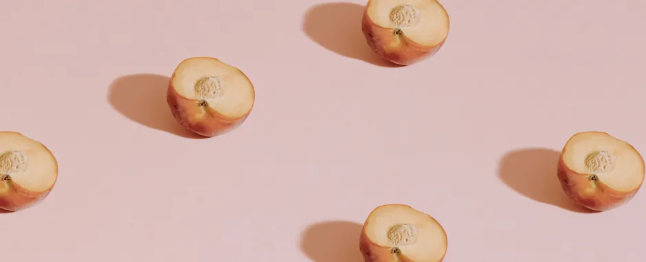 peaches on pink background