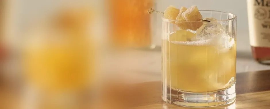 Ginger and mint cocktail on blurred background