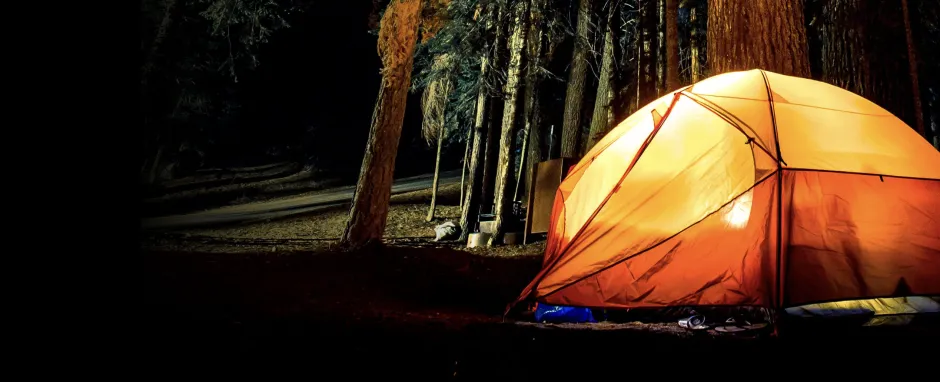 Nighttime photo of orange tent