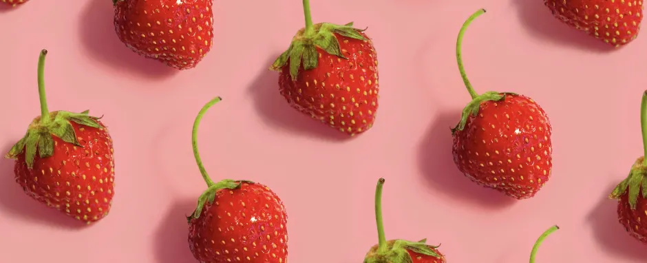 Strawberries on pink background