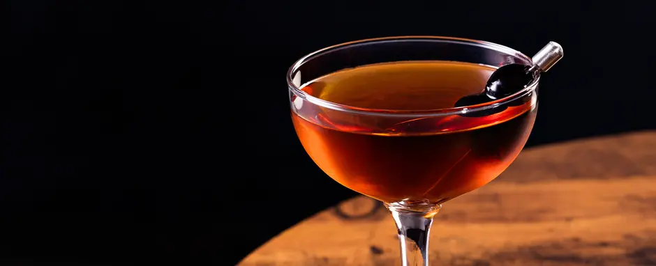 manhattan cocktail on a wood table