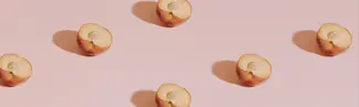 peaches on pink background