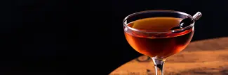 manhattan cocktail on a wood table