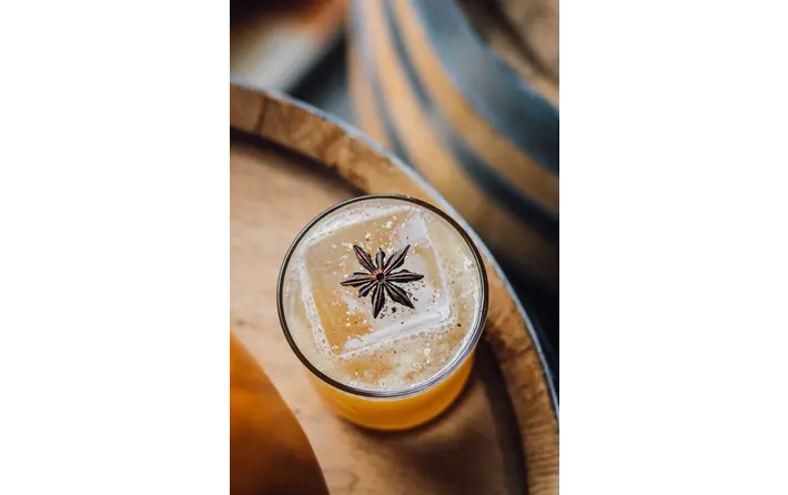 Crisp Autumn fall spiced cocktail with calvados, allspice dram, ginger liqueur and lime. Recipe by Ethan Guillemette