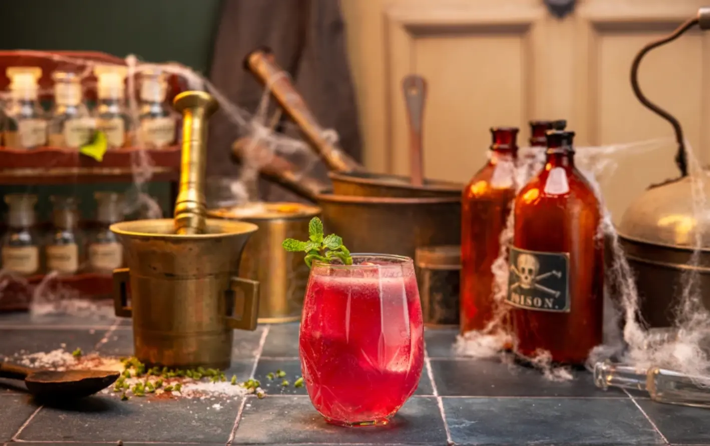 A red cocktail with a halloween theme