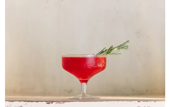 Raspberry pomegranate cosmo cocktail. Recipe by Ethan Guillemette.