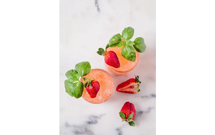 Strawberry basil peach sparkler cocktail. Recipe by Ethan Guillemette